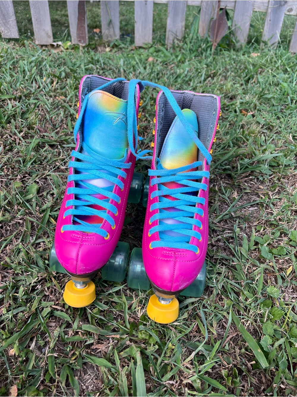Kids Pink Roller Skates with Rainbow Tongue and Teal Laces